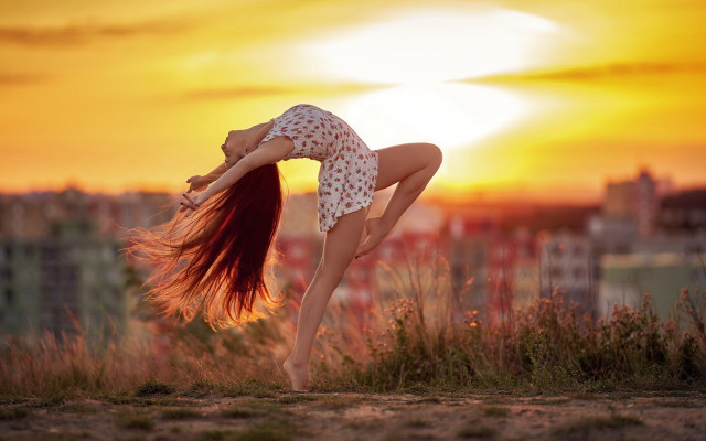 Woman handstand hill sunset blurry free wallpaper - medium preview image