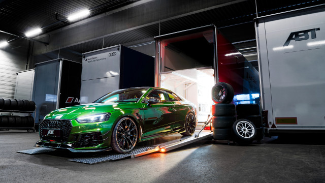 Green car loading trailer truck free wallpaper - medium preview image