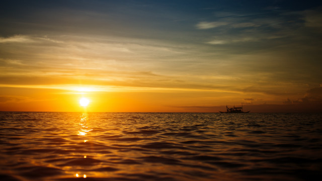 Boat ocean sunset mountains reflection free wallpaper - medium preview image