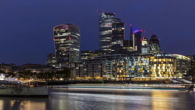 Night city skyline boat reflection free wallpaper - medium preview image