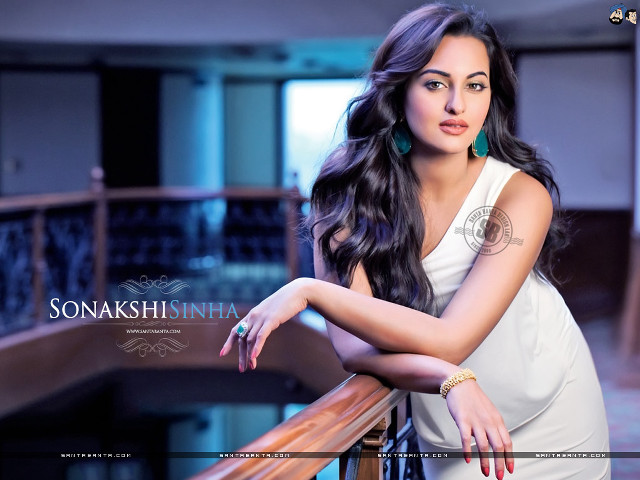 Woman leaning railing arms crossed free wallpaper - medium preview image