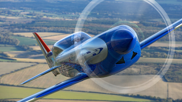 Blue airplane green field circular free wallpaper - medium preview image