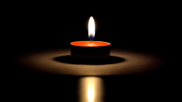 Lit candle reflection black background free wallpaper - medium preview image