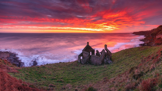 Sunset cliff grassy field water free wallpaper - medium preview image