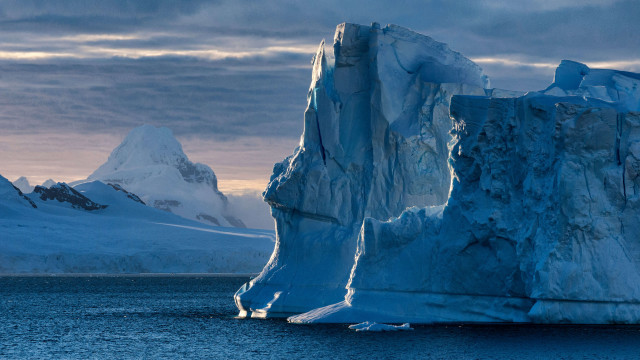 Iceberg mountain ocean cloudy sky free wallpaper - medium preview image