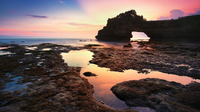 Rock formation hole sunset reflection free wallpaper - medium preview image