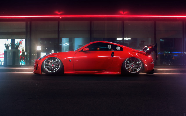 Red sports car night building free wallpaper - medium preview image