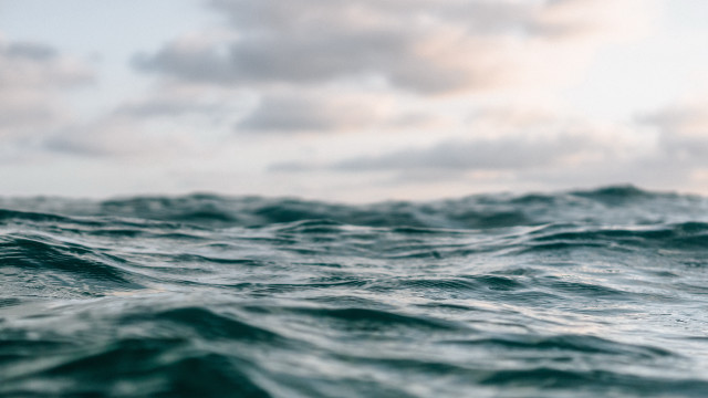 Ocean waves clouds surfboard beach free wallpaper - medium preview image
