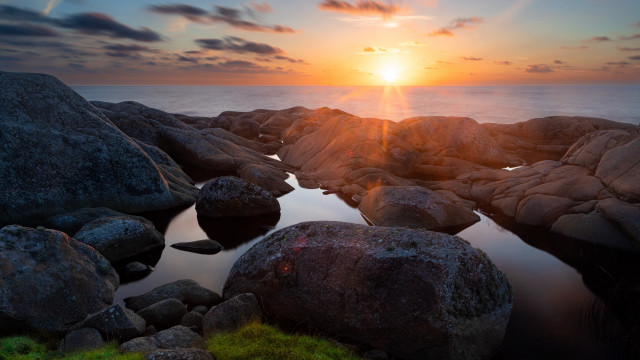 Sunset rocky beach water grass free wallpaper - medium preview image