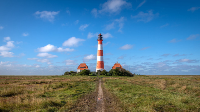 Lighthouse grassy field dirt path free wallpaper - medium preview image