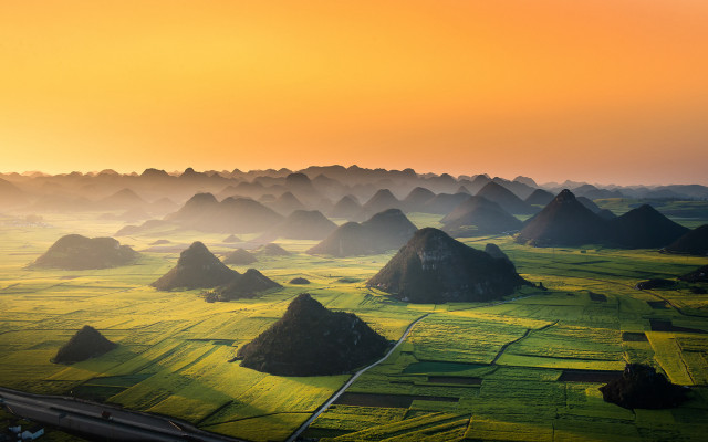 Green grass yellow sky mountains free wallpaper - medium preview image