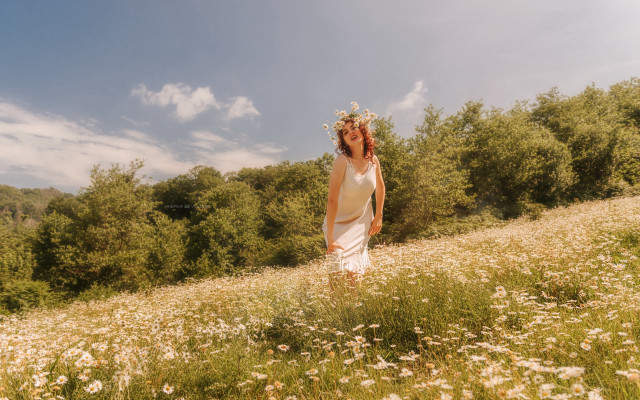 Flower field woman frisbee sky free wallpaper - medium preview image