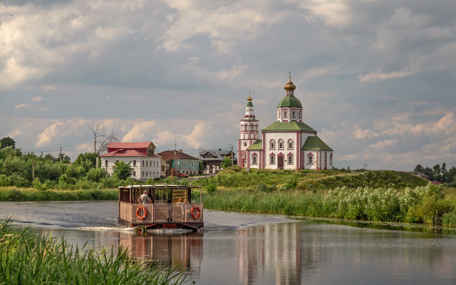 Boat river church cloudy sky free wallpaper - medium preview image
