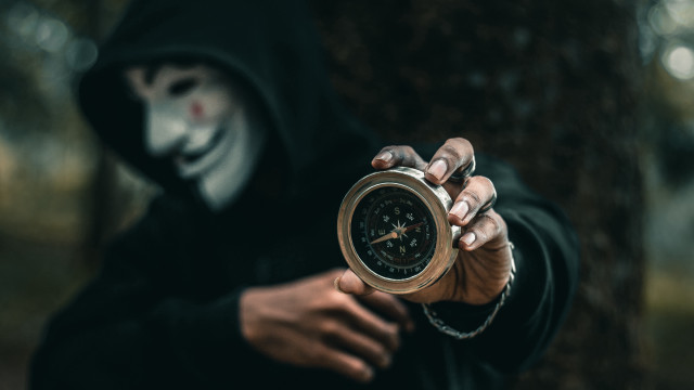Creepy hooded person clock mask free wallpaper - medium preview image