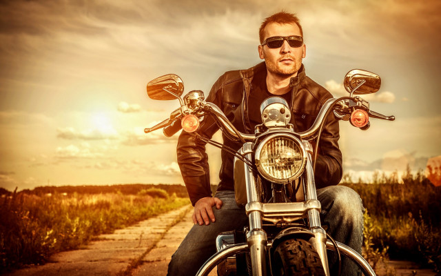 Bald man motorcycle field sunset free wallpaper - medium preview image