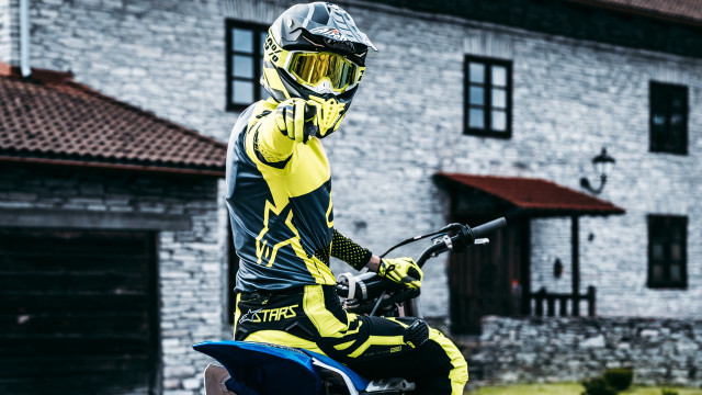 Motorcycle man yellow black outfit free wallpaper - medium preview image