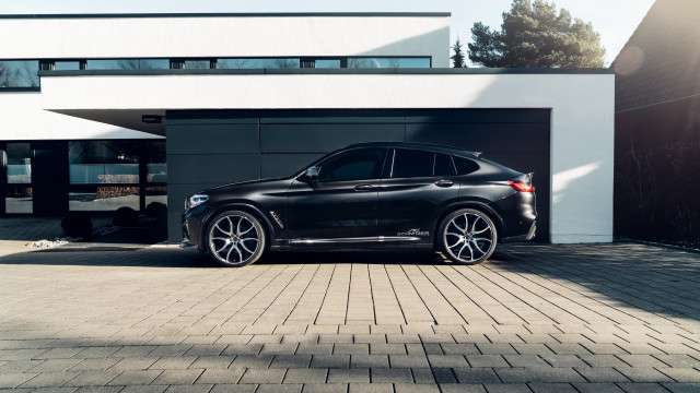 Black car building white roof free wallpaper - medium preview image
