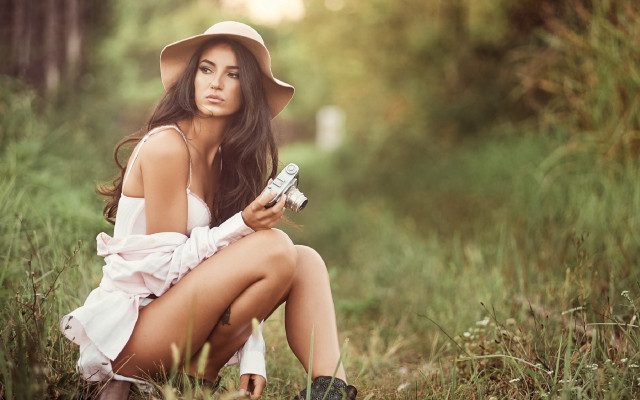 Woman hat sitting grass phone free wallpaper - medium preview image