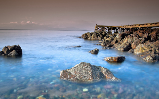 Pier rocky shore ocean blue free wallpaper - medium preview image