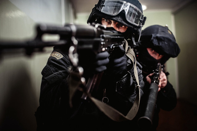 Man black jacket gun helmet free wallpaper - medium preview image