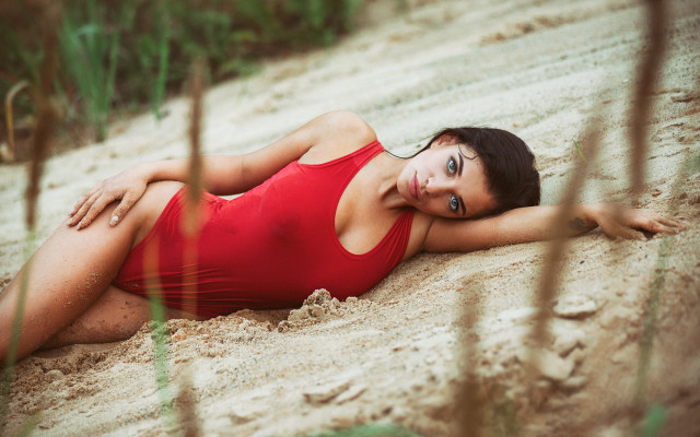 Red swimsuit beach laying blurry free wallpaper - medium preview image