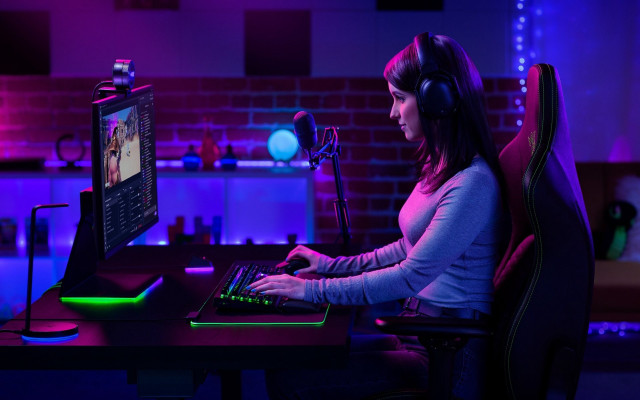 Woman sitting desk computer headphones free wallpaper - medium preview image