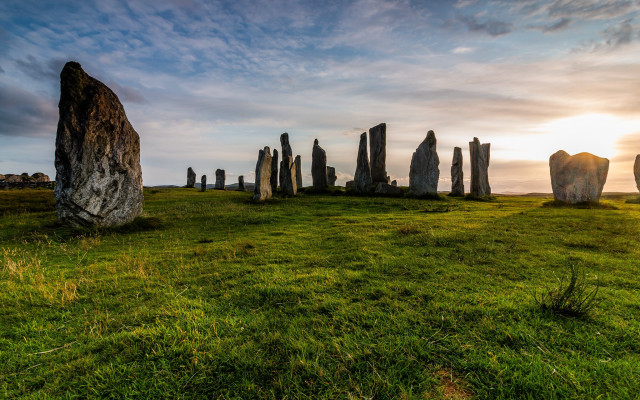 Grassy field rock formation cloudy free wallpaper - medium preview image