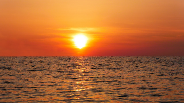 Sunset ocean boat distant cloud free wallpaper - medium preview image