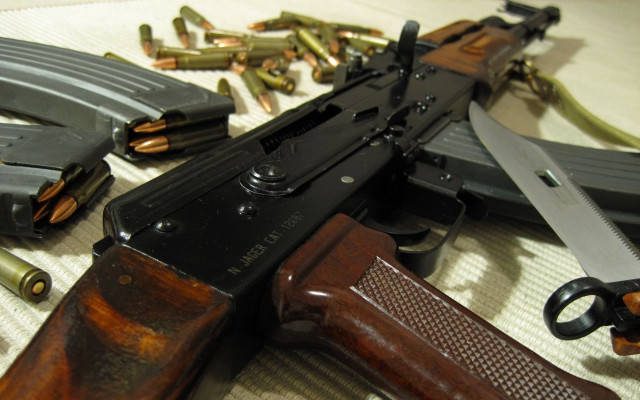 Gun table items surrounding laying free wallpaper - medium preview image