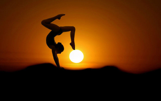 Handstand sunset silhouette moon orange free wallpaper - medium preview image