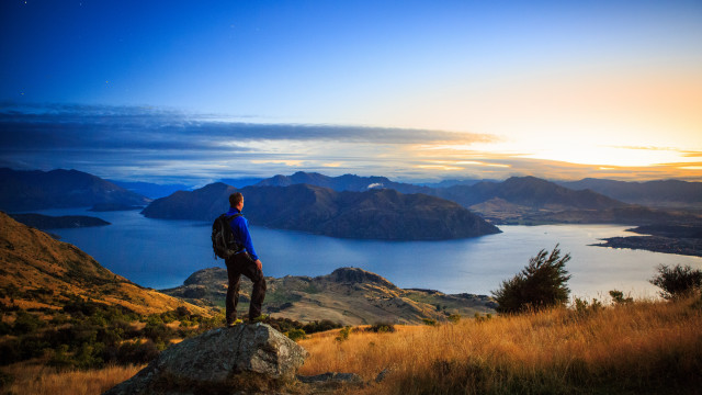 Mountain lake sunset man backpack free wallpaper - medium preview image