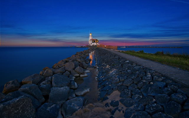 Lighthouse rocky shore dusk reflection free wallpaper - medium preview image