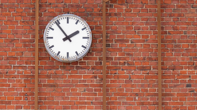Clock brick wall window bars free wallpaper - medium preview image