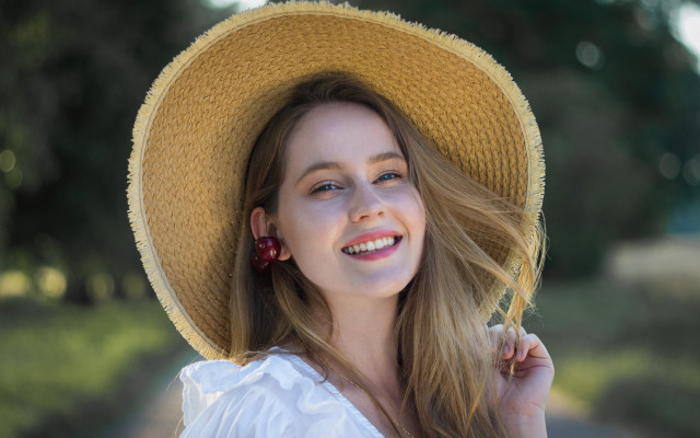 Woman yellow hat smiling tree free wallpaper - medium preview image