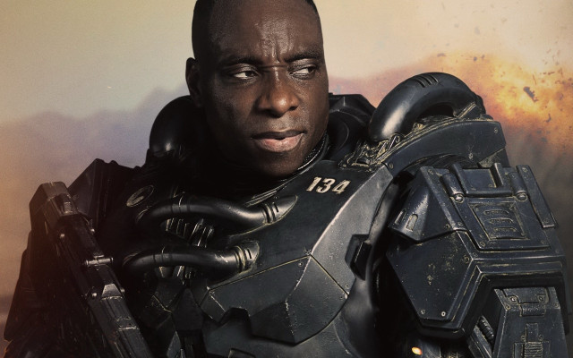 Futuristic man armor gun fire free wallpaper - medium preview image