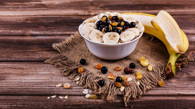 Bowl cereal bananas raisins wooden free wallpaper - medium preview image