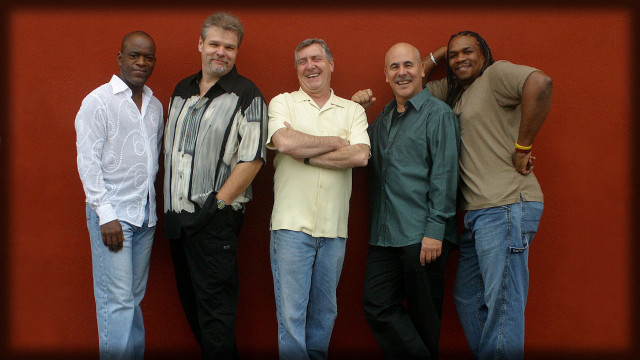 Men group red wall smiling free wallpaper - medium preview image