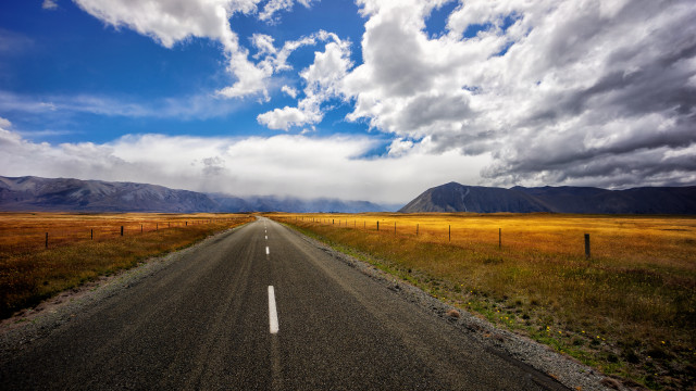 Long road fence mountains cloudy free wallpaper - medium preview image