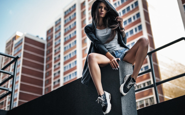 Woman ledge sitting hooded sneakers free wallpaper - medium preview image