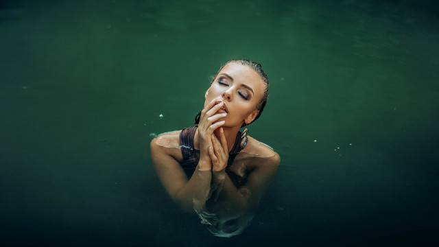 Woman floating water hands face free wallpaper - medium preview image