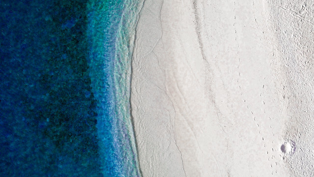 Beach ocean sand land art free wallpaper - medium preview image