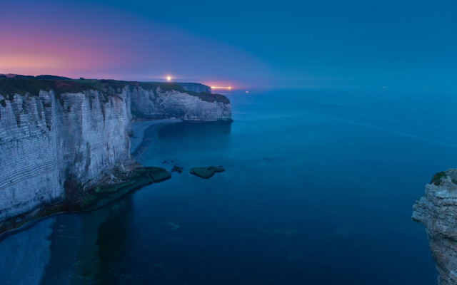 Cliff face water night lighthouse free wallpaper - medium preview image