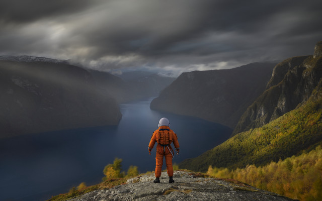 Man orange suit cliff lake free wallpaper - medium preview image