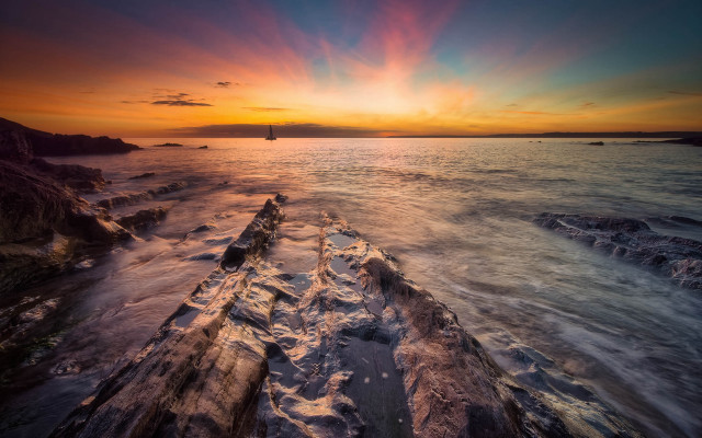 Sunset ocean boat rocky shore #2 free wallpaper - medium preview image