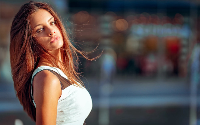 Woman longhair building bokeh portrait free wallpaper - medium preview image