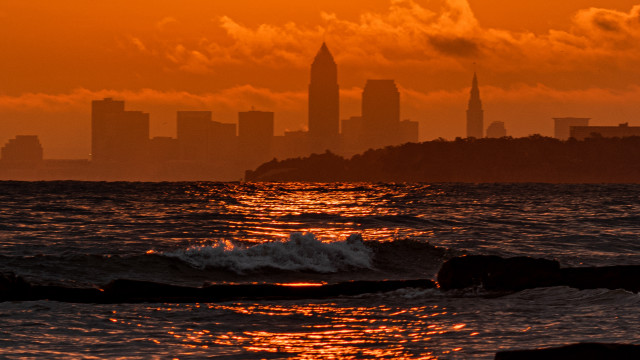 City skyline ocean sunset waves free wallpaper - medium preview image