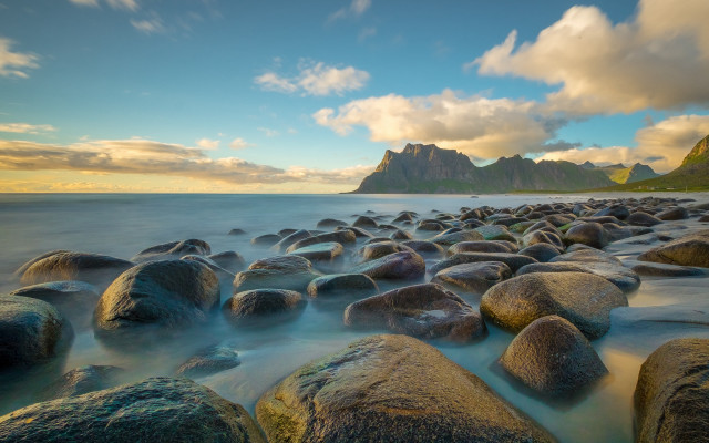 Rocky beach sunset mountains boat free wallpaper - medium preview image