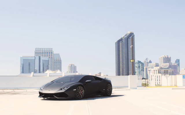 Black sports car city skyline free wallpaper - medium preview image