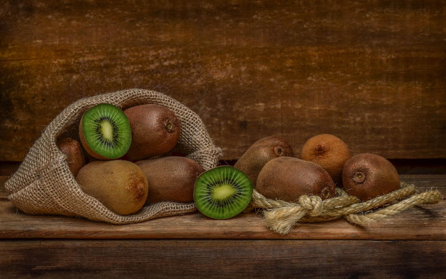 Kiwi basket wooden table food free wallpaper - medium preview image