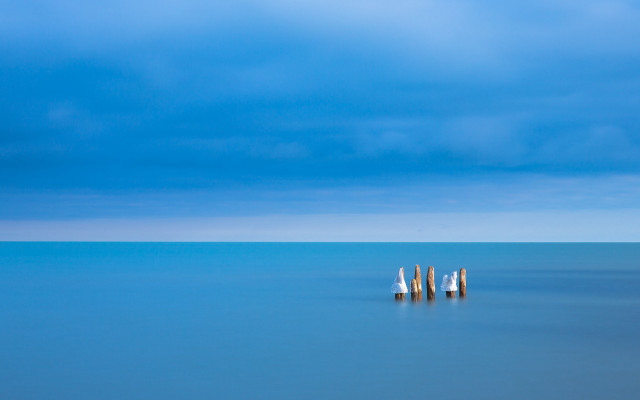 Ocean poles cloudy sky blue free wallpaper - medium preview image